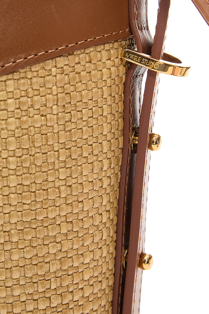 Beige shoulder bucket bag by Vikele Studio with a rounded shape and shoulder strap, stylish and spacious for everyday use.