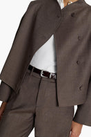 Acaria Studio Sahara jacket in coffee color, stylish and warm outerwear with a tailored fit, shown on a model.