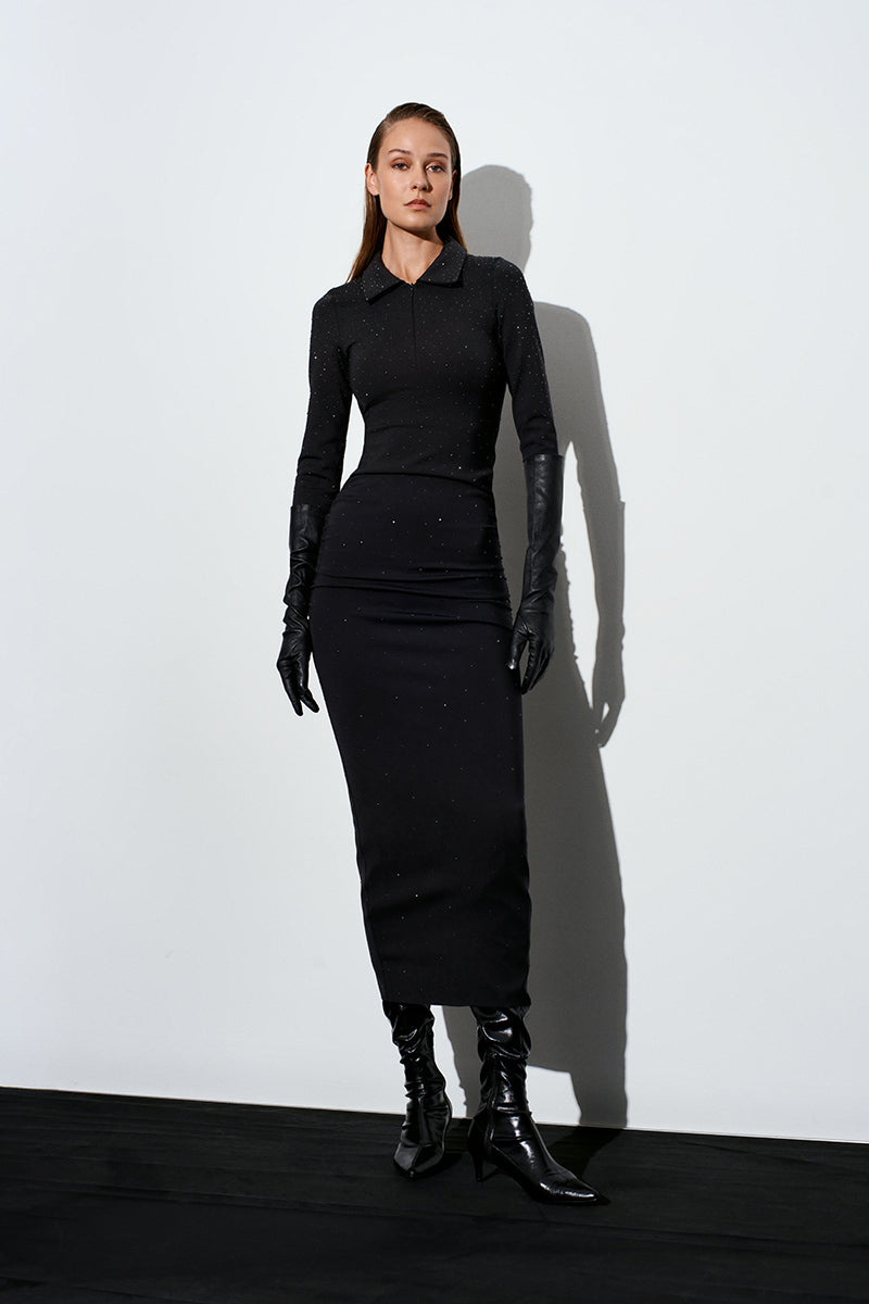 Black Acaria Studio scuba dress with rhinestones, featuring a maxi length and elegant design, visible details of the embellished neckline.