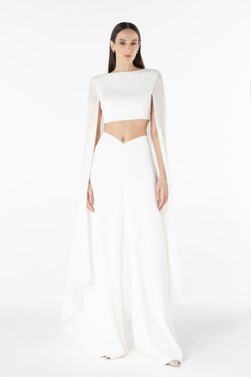 Lili Blanc sculpted wide trousers in a relaxed fit, featuring a high waist and tailored design, shown in a neutral fabric.