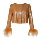 Rayane Bacha Astra Sequin Feather Vest jacket featuring shimmering sequins and feather details, stylishly displayed on a hanger.