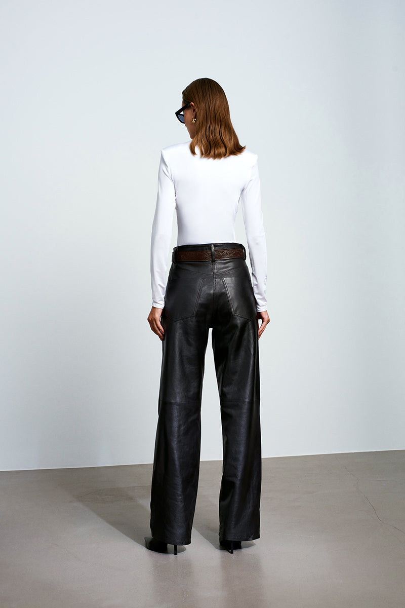 White Chandra bodysuit by Acaria Studio, stylish women's top with fitted design and scoop neckline, shown on a mannequin.