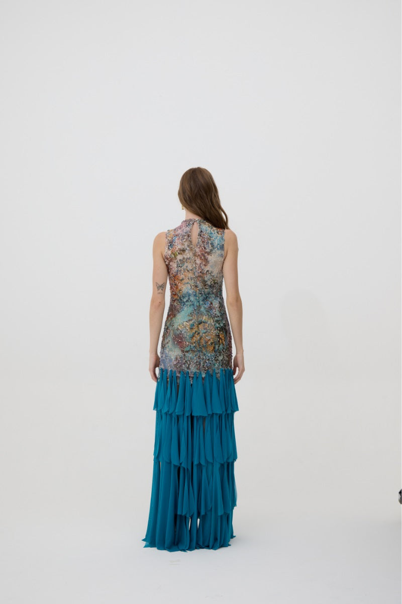 Kontenta Marina party dress in Netuno blue, a stylish maxi dress with flowing fabric and elegant design for special occasions.