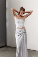 Nazlı Ceren Corinne satin maxi skirt in silver lining, flowing and elegant with smooth satin fabric and a high waist design.