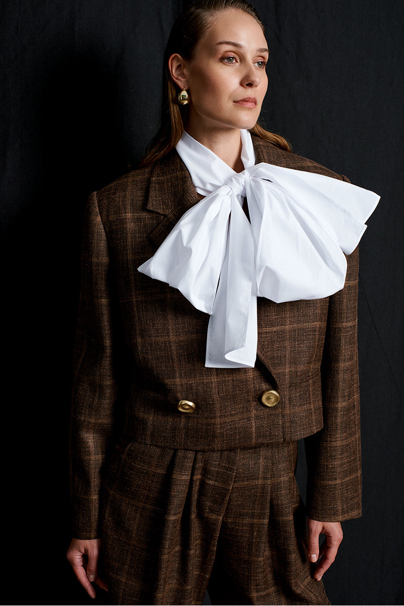 Acaria Studio brown Guru crop blazer shown on a model, tailored fit with lapel collar and stylish design for modern fashion.