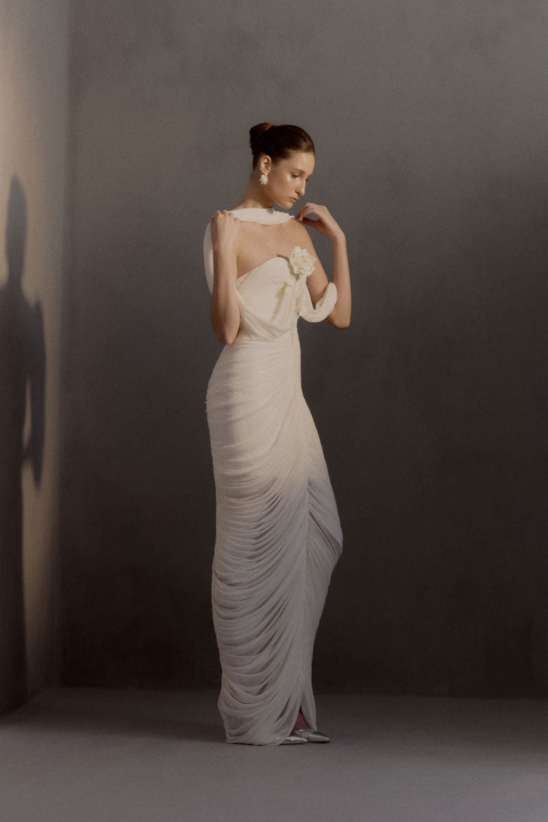 White Plan Sedley dress gown with elegant flowy fabric, long sleeves, and a stylish neckline, perfect for formal occasions.