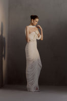 White Plan Sedley dress gown with elegant flowy fabric, long sleeves, and a stylish neckline, perfect for formal occasions.