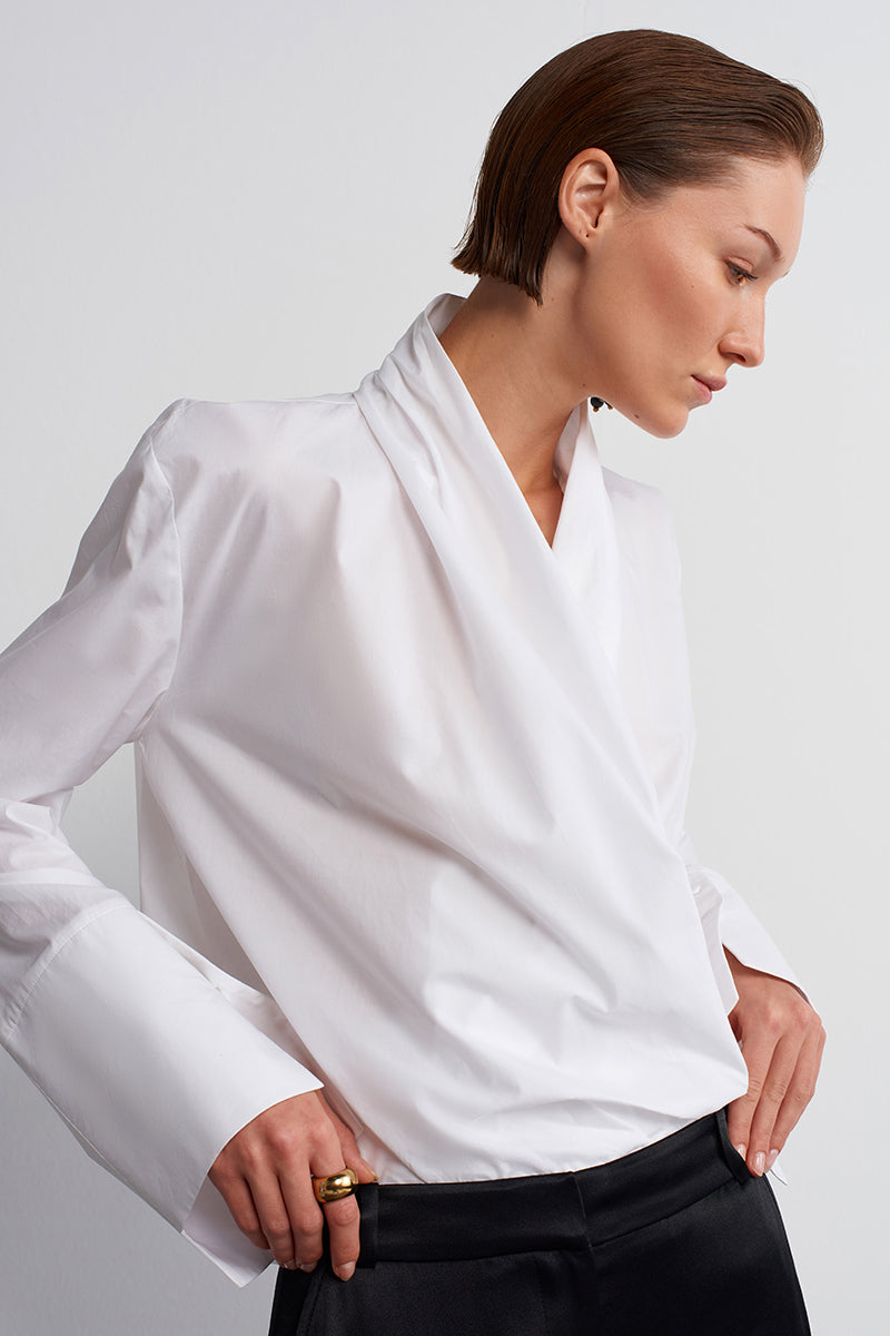 White historical shirt by Acaria Studio, featuring classic design and detailed fabric visible in the image.