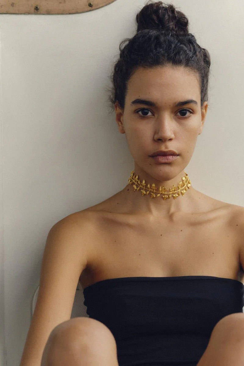 Peracas Carolina choker necklace featuring a sleek, modern design with a black band and subtle metallic accents.