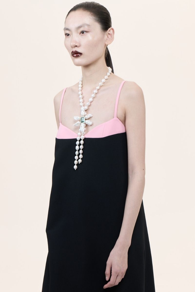 Nihan Peker Siena strapless gown in elegant fabric, featuring a fitted bodice and flowing skirt for formal occasions.