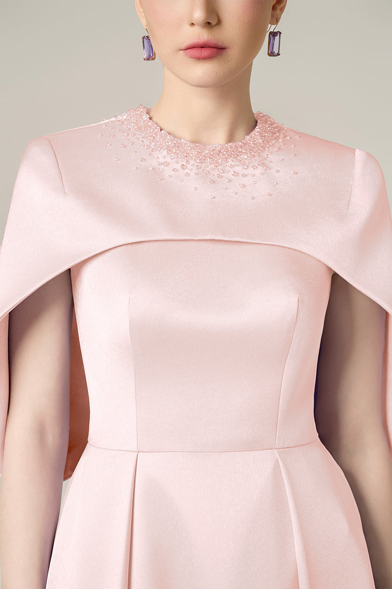 Pink silk taffeta gown by I.H.F featuring elegant draping and a flowing silhouette perfect for formal occasions.