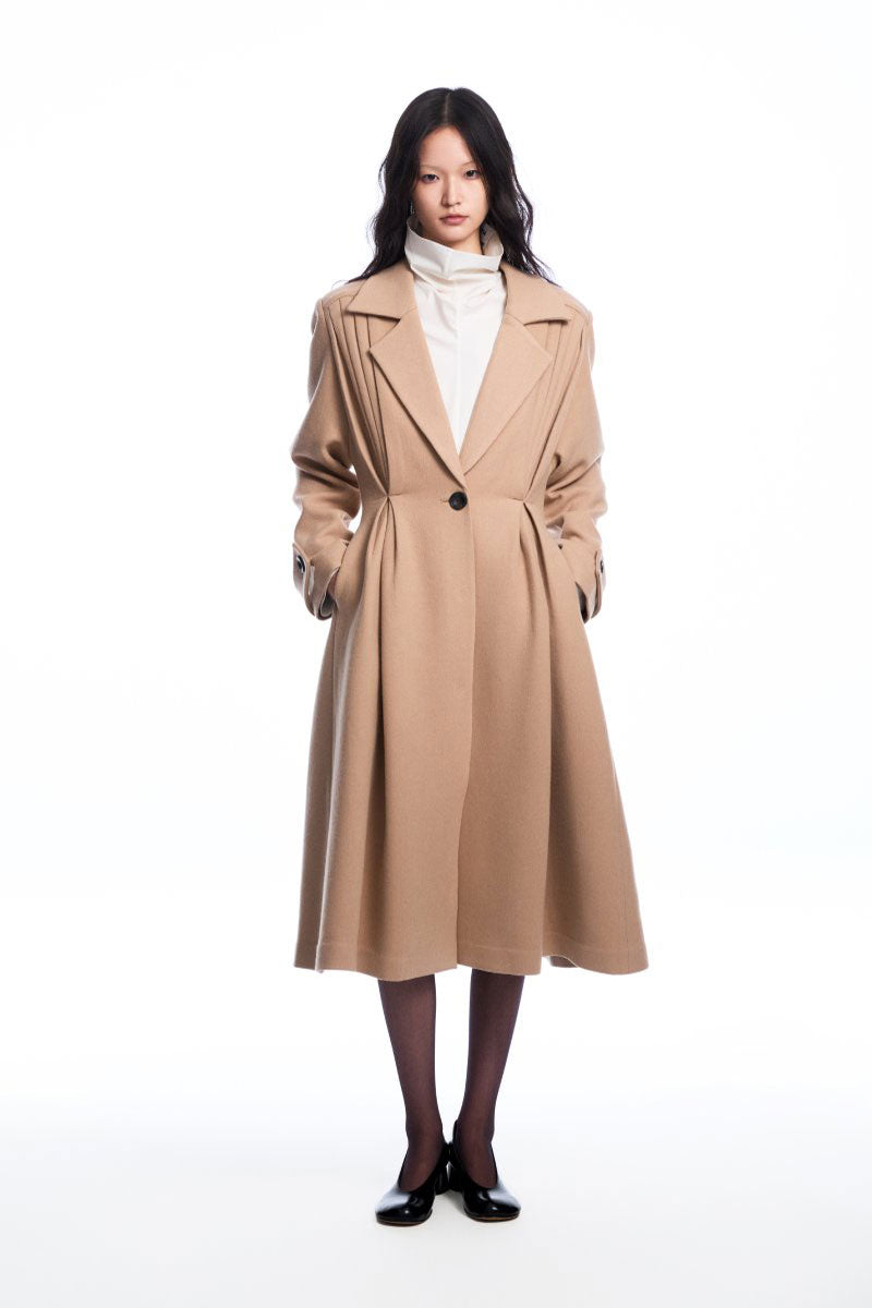 Beige wool coat with pleats from Chictopia, featuring a tailored fit and classic style perfect for cold weather.