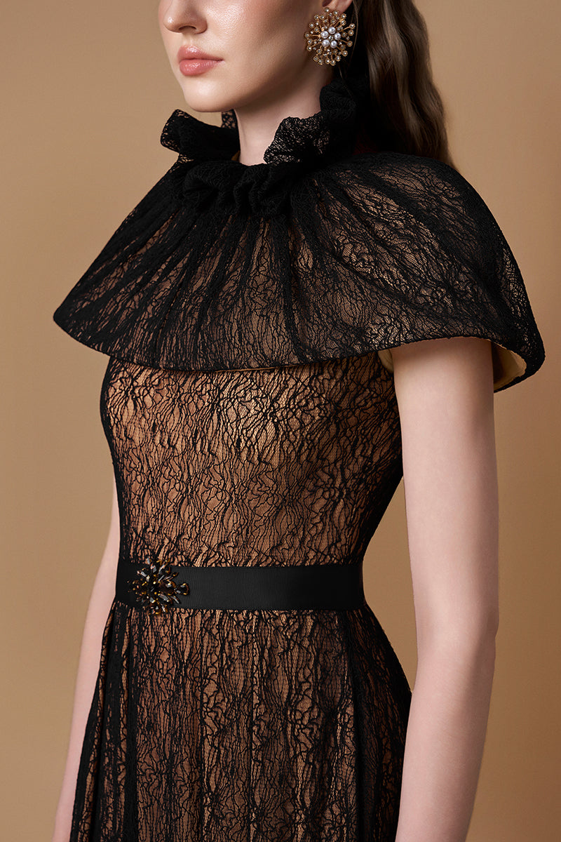 Black VINE GUIPURE LACE gown by I.H.F featuring intricate lace details and a flowing silhouette.