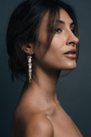 Freya Rose baroque pearl long drop earrings featuring elegant, irregular-shaped pearls and delicate gold hooks.