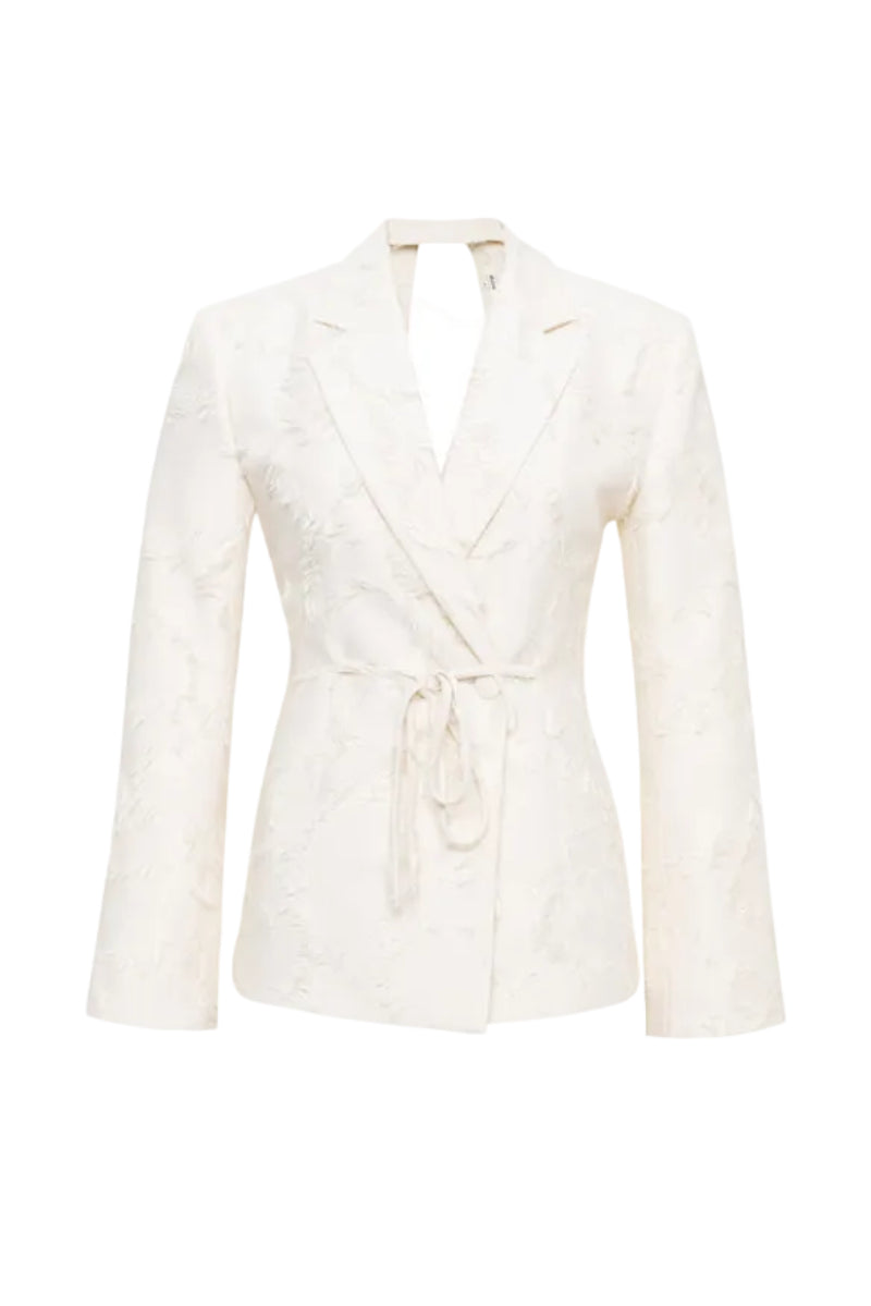 Cream JORA fringe open-back blazer by SÉLONE featuring a stylish fringe detail and tailored fit, perfect for chic, modern looks.