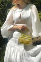 Touchless CULT MIA X clutch handbag featuring a green and yellow gem blend design with a sleek, modern style.