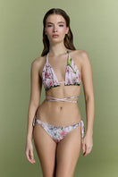 Nur Karaata Sunset Palms bikini featuring a colorful tropical print on a stylish two-piece swimsuit.