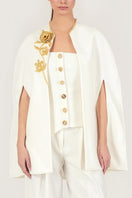 Gold thread embroidered cape by Monika Dimova, showcasing intricate embroidery and elegant jacket design with luxurious fabric.