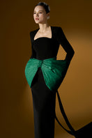 Green Loreli crepe and taffeta gown by I.H.F with flowing fabric and elegant design, showcased on a model.