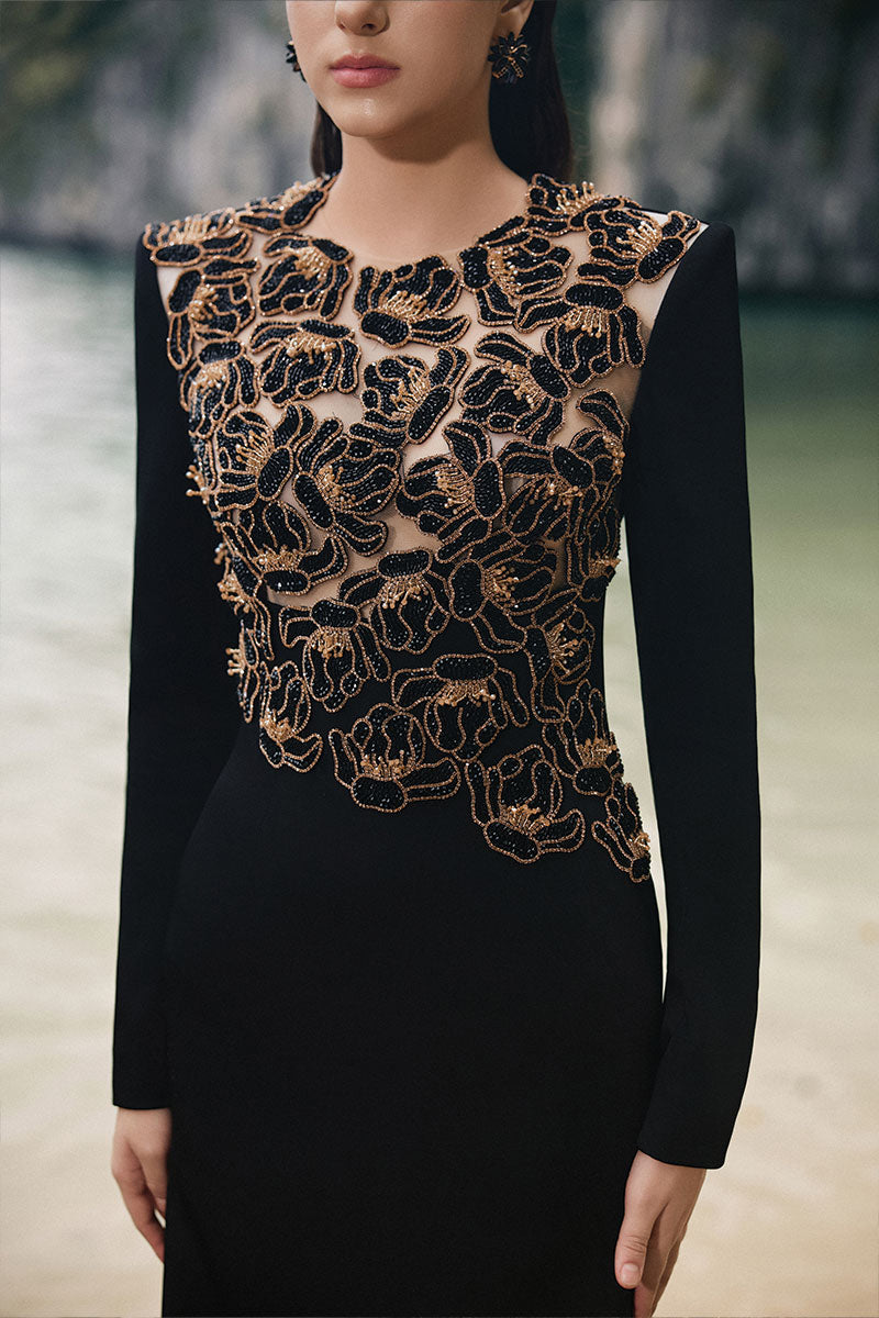 Black velvet satin gown by Lune De Soie with floral embellishments and elegant design, perfect for formal occasions.