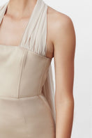 Nazlı Ceren Clarine long maxi dress in Cuban sand color, flowing fabric with elegant design and sleeveless style.