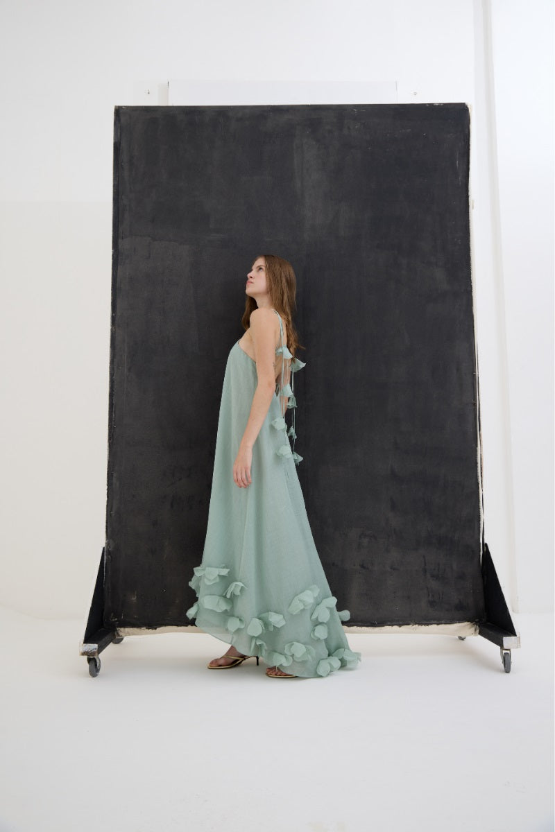 Mint green Kontenta Aurora maxi dress with flowing fabric and sleeveless design, perfect for casual or summer occasions.
