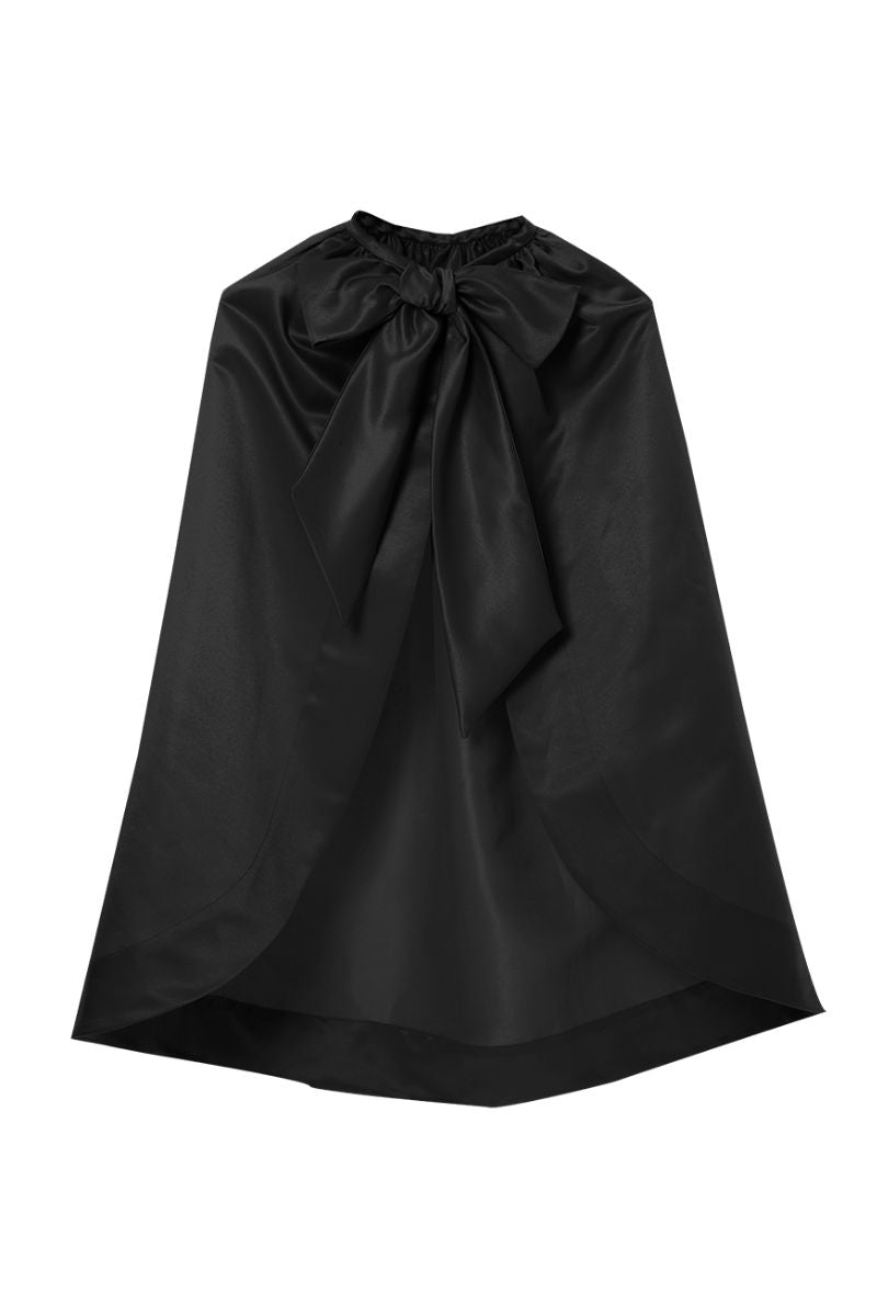Black IRIS JET Cape jacket by BAÉ shown on a model, featuring sleek design and stylish fit.