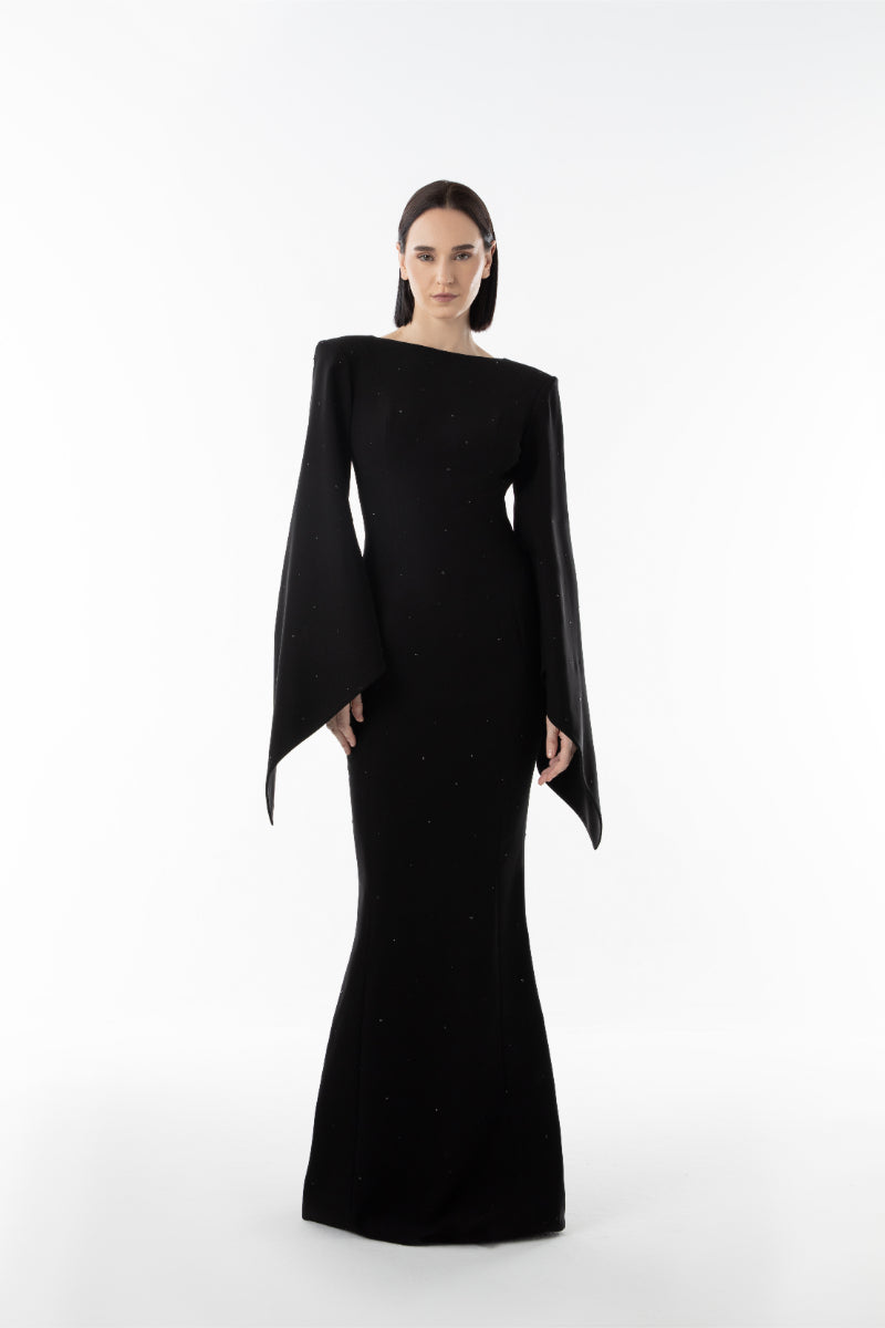 Lili Blanc Ember Black gown featuring elegant fabric and a flowing silhouette, perfect for formal occasions.