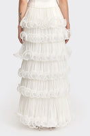 Off-white MS. Tutu maxi skirt by Stolen Stores, flowing fabric with a high waist and layered ruffle design.