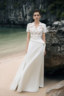 Lune De Soie white satin taffeta gown with elegant flowing design and intricate detailing, perfect for formal occasions.