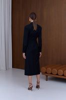 Undress Edith black wool midi dress displayed, featuring a fitted silhouette and elegant length, perfect for stylish occasions.