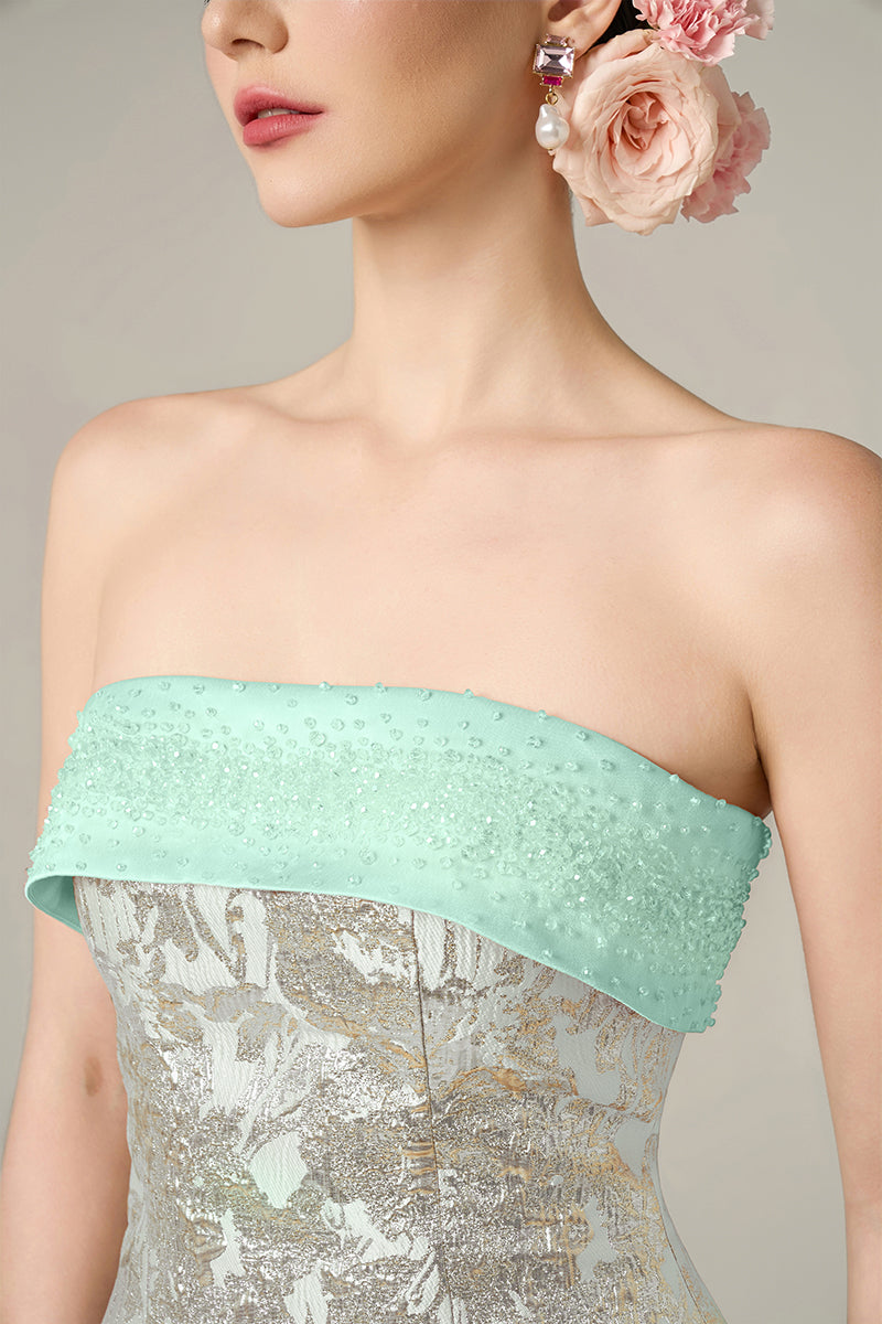 Green metallic jacquard and silk taffeta gown by I.H.F featuring intricate patterns and elegant draping.