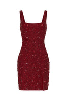 Red KERRI mini dress by Khanum's featuring a fitted silhouette and stylish design, shown on a model.