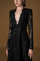 Black V-neck A-line lace gown with long sleeves by I.H.F, featuring intricate lace details and a flowing silhouette.