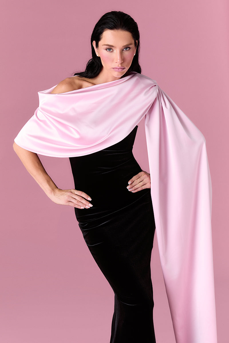 Elegant Nur Karaata Amoura gown with intricate embroidery and flowing fabric, designed for formal occasions.