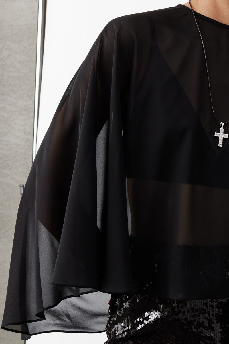 Black chiffon cape jacket by Nazlı Ceren, stylish flowy outerwear with elegant drape, perfect for layered fashion looks.