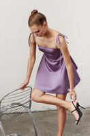 Nazlı Ceren Juniper mini dress in mauve, stylish short dress with a fitted silhouette and elegant design, displayed on a hanger.