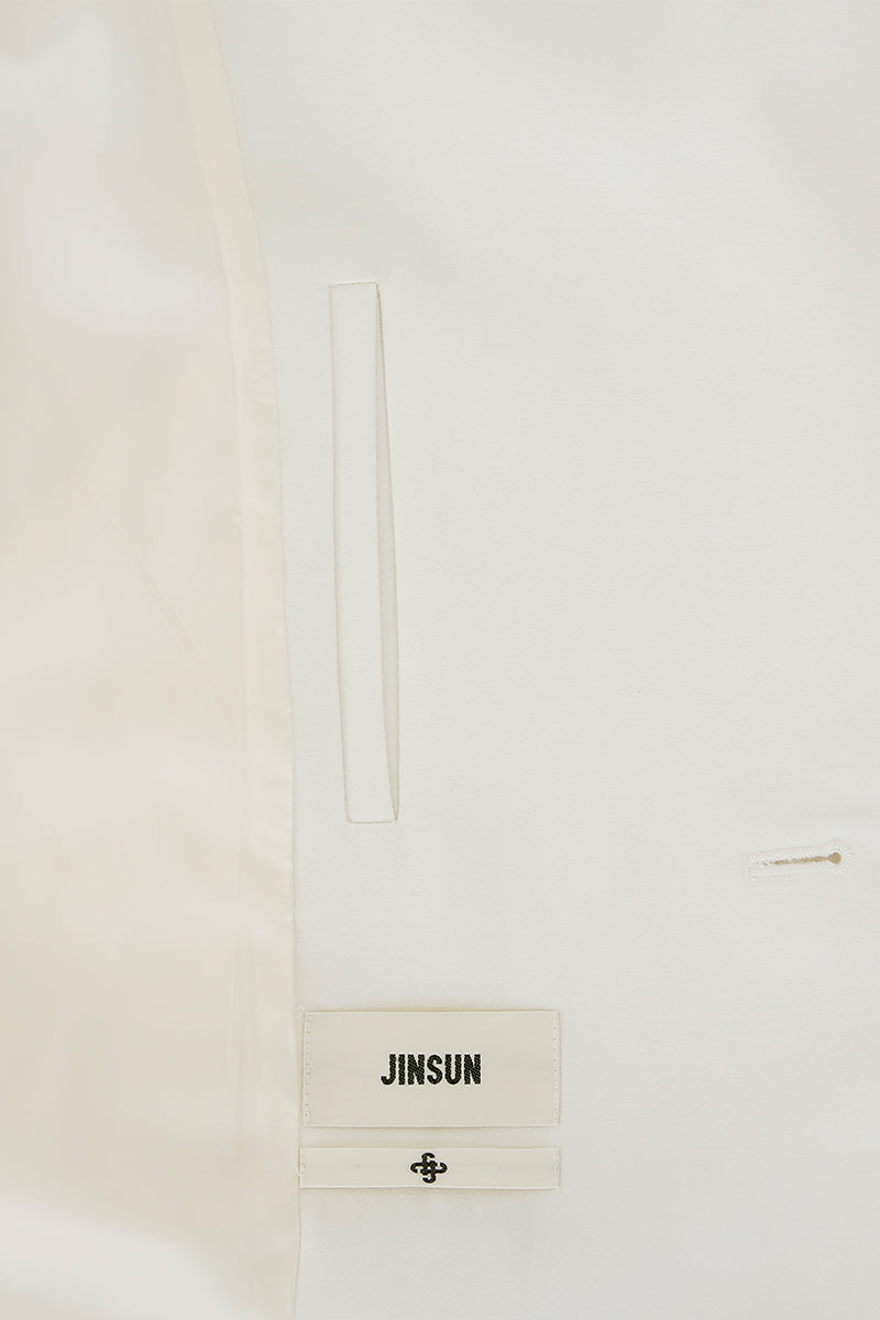 JINSUN Astral Couture wool coat in neutral color, stylish and warm, displayed hanging on a wooden hanger.
