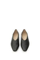Black VIKELE STUDIO flats shoes with a sleek, minimalist design, shown on a neutral background.