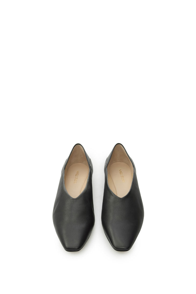 Black VIKELE STUDIO flats shoes with a sleek, minimalist design, shown on a neutral background.