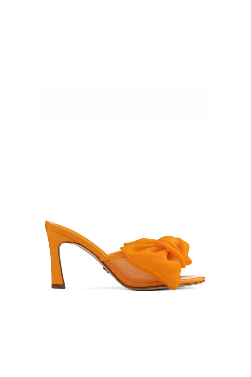 Orange patent bow mules sandals by House of Atana, stylish slip-on footwear with bow detail and shiny finish.