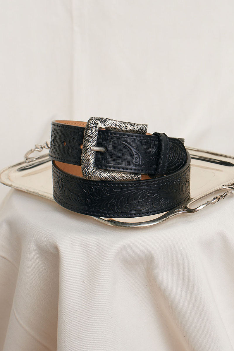 Black leather belt with silver buckle from Acaria Studio, featuring a sleek design and durable craftsmanship.