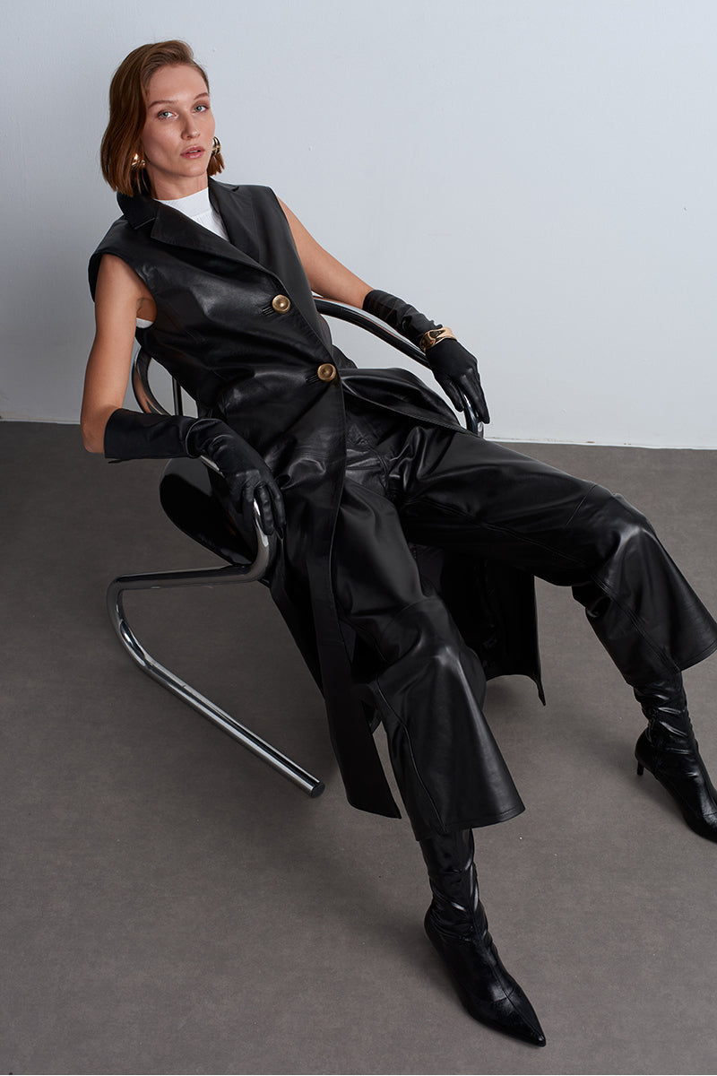 Black Mercury leather vest by Acaria Studio featuring a fitted design and sleek leather texture.