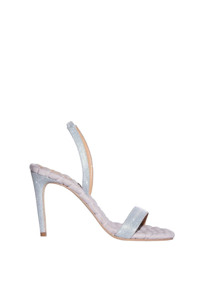 A pair of VIVIEN silver Lurex slingback sandals by AERA with open toes and metallic finish, displayed on a neutral background.