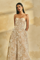 L'SCARLETT A-line spaghetti strap gown with intricate lace detailing and a fitted silhouette, perfect for elegant occasions.