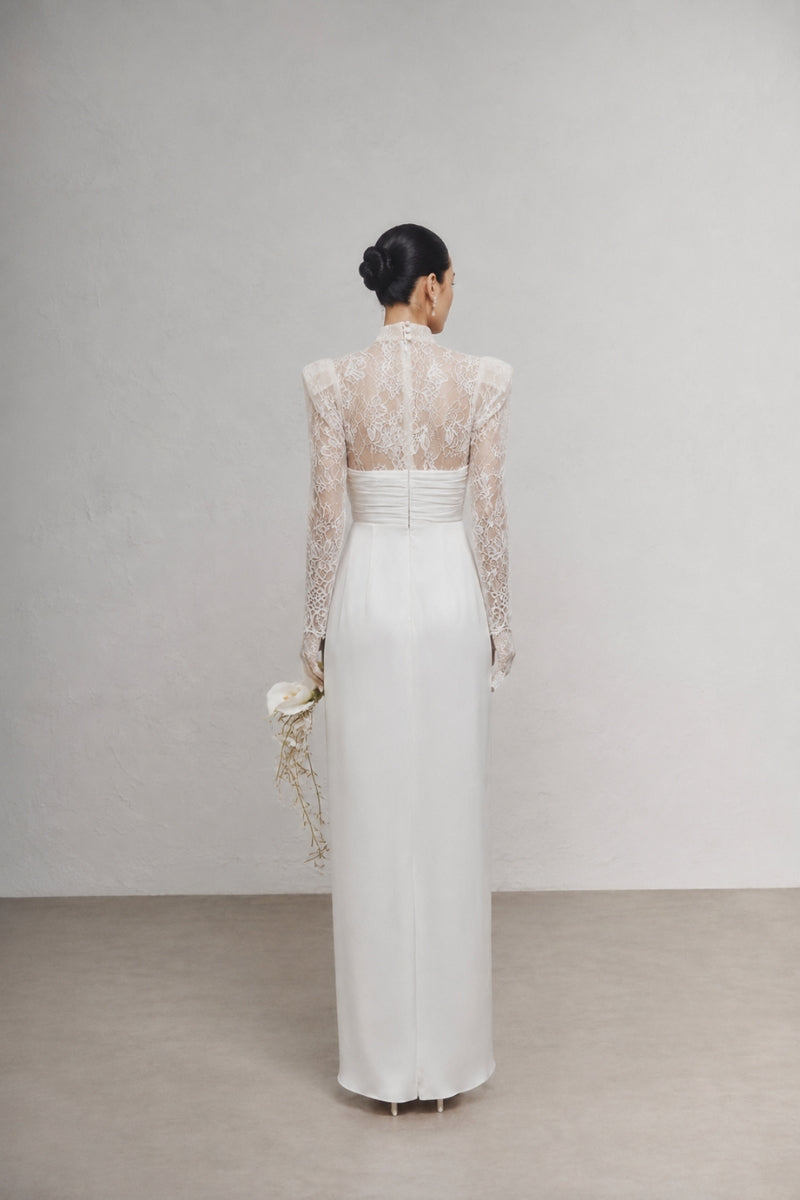 White Plan MIKOL maxi dress featuring a flowing silhouette and elegant design, perfect for summer or special occasions.