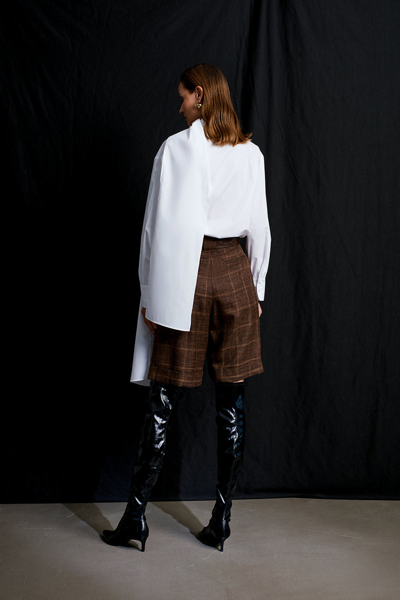 Acaria Studio romantic shirt featuring soft fabric, stylish design, and a flattering fit displayed on a hanger.
