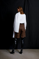 Acaria Studio romantic shirt featuring soft fabric, stylish design, and a flattering fit displayed on a hanger.