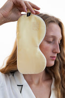Soft butter yellow silk eye mask from Not Just Pajama, designed for comfortable loungewear and relaxing sleep.