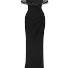 Elegant black Dahlia gown by Le Thanh Hoa featuring flowing fabric and intricate detailing, perfect for formal occasions.